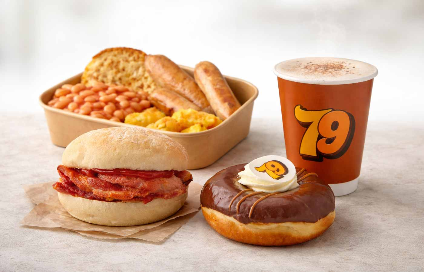 Bakery breakfast in the UK – bacon bap, coffee and donut